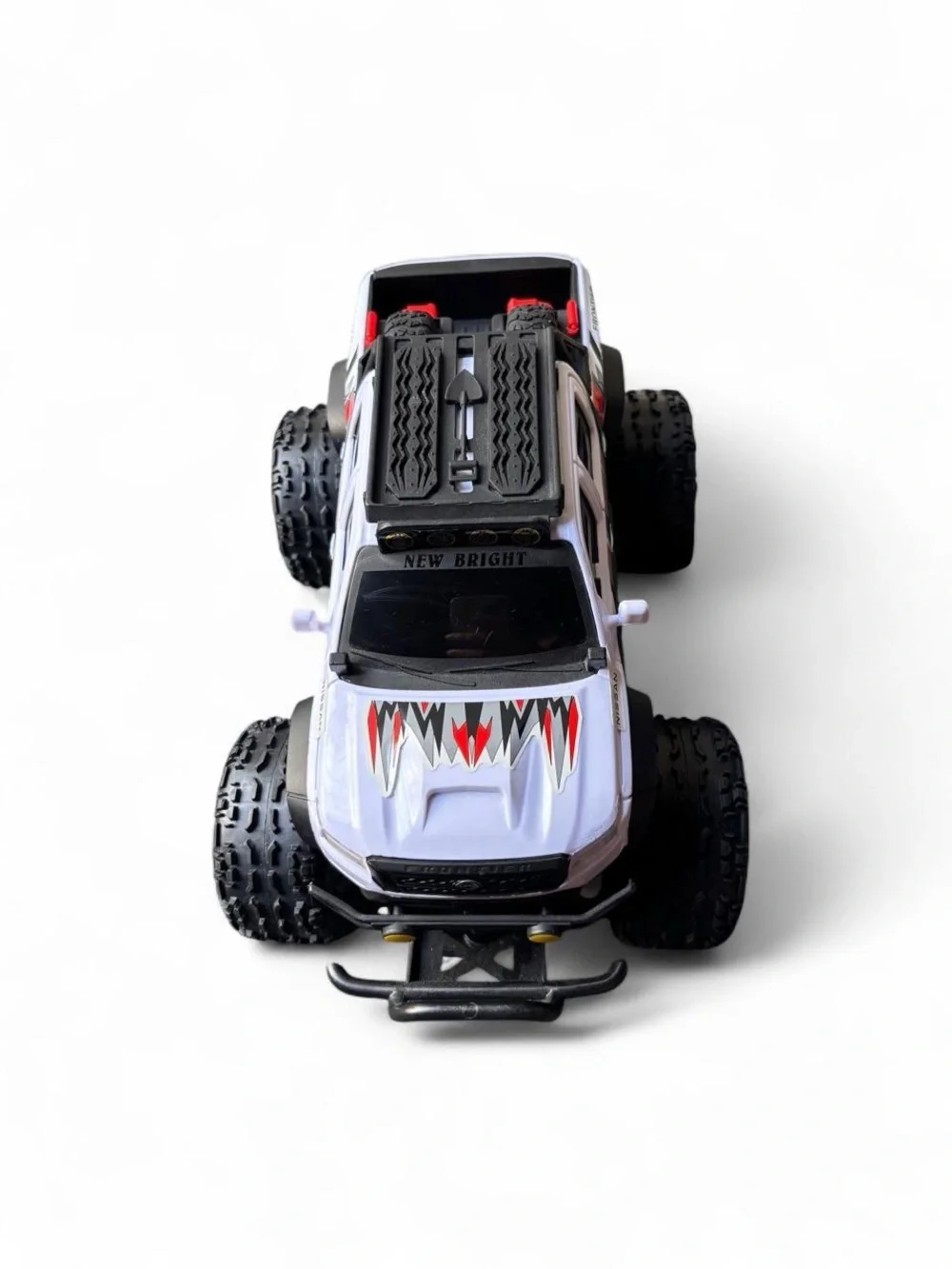 Nissan Frontier RC Truck with black & red lightning bolt graphics
